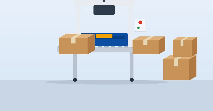 Carton sealing machine taping cartons with finished cartons beside it
