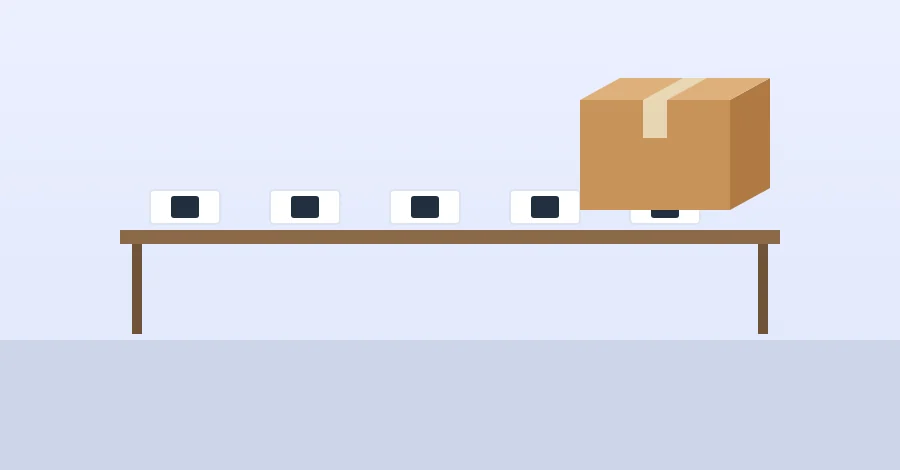 Small electronic devices on a table next to a carton
